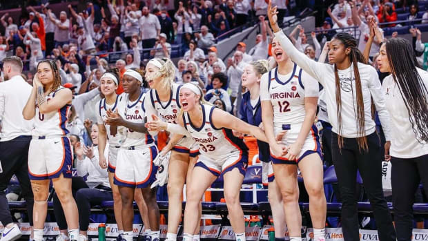 The UVA bench celebrates during the Virginia women's basketball game against Virginia Tech at John Paul Jones Arena.